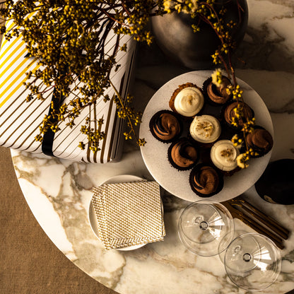 White cocktail napkin with gold abstract pattern