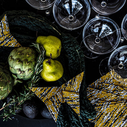 Gold, black and white cocktail napkin with abstract pattern