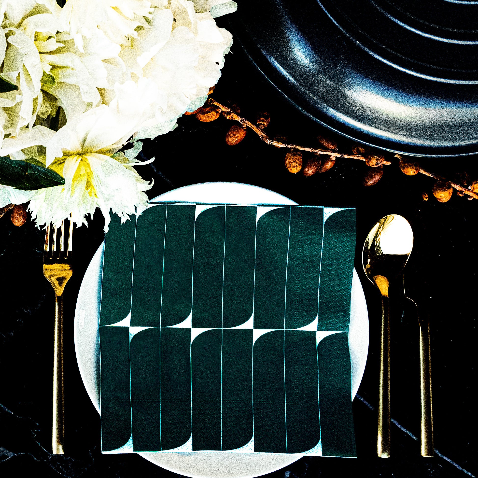 Teal and white dinner napkin with abstract design