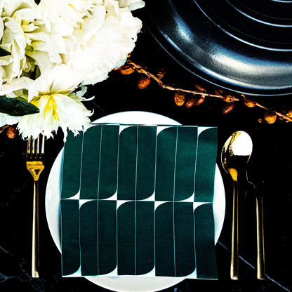 Teal and white dinner napkin with abstract design