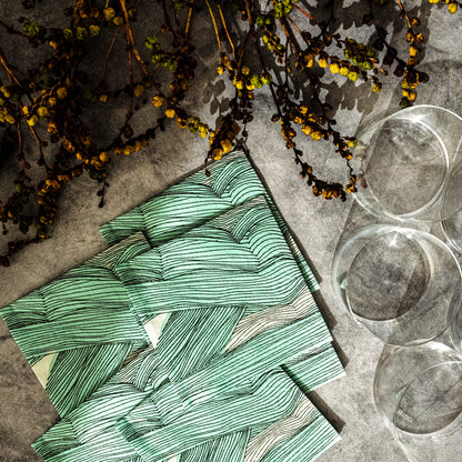 Green, black and off-white cocktail napkin with abstract pattern