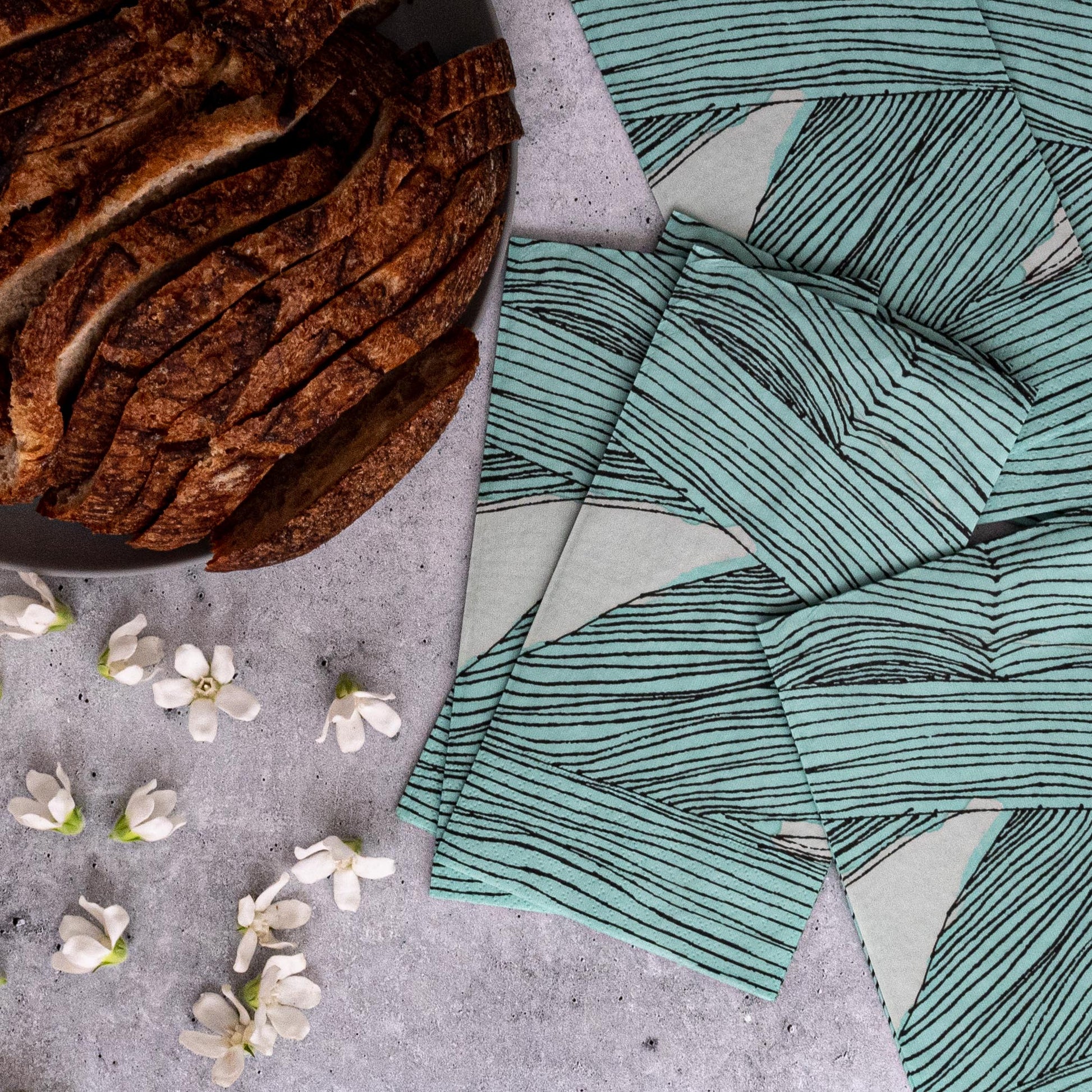 Green, black and off-white guest towel napkin with abstract pattern