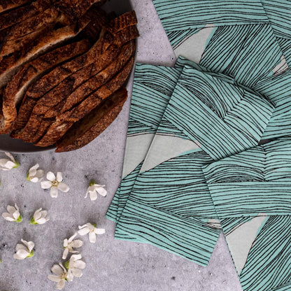 Green, black and off-white guest towel napkin with abstract pattern