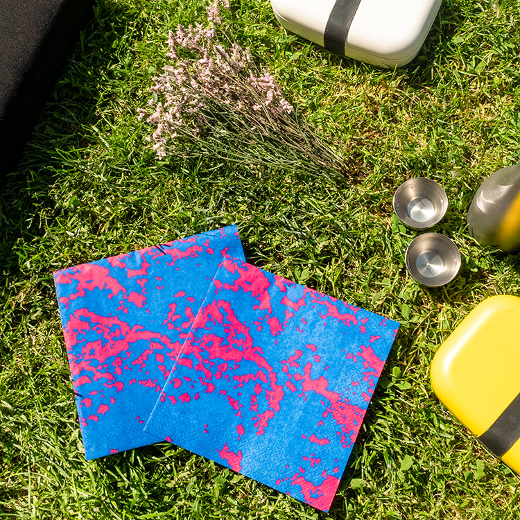 Blue and pink dinner napkin with abstract pattern