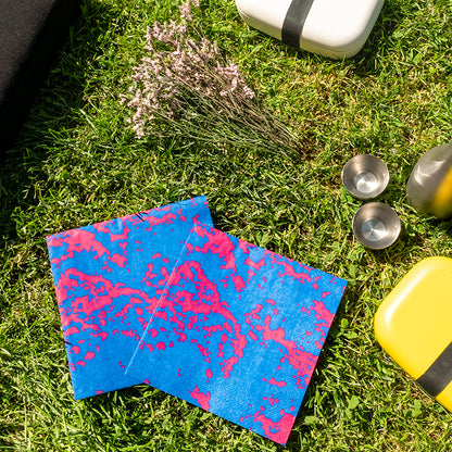 Blue and pink dinner napkin with abstract pattern