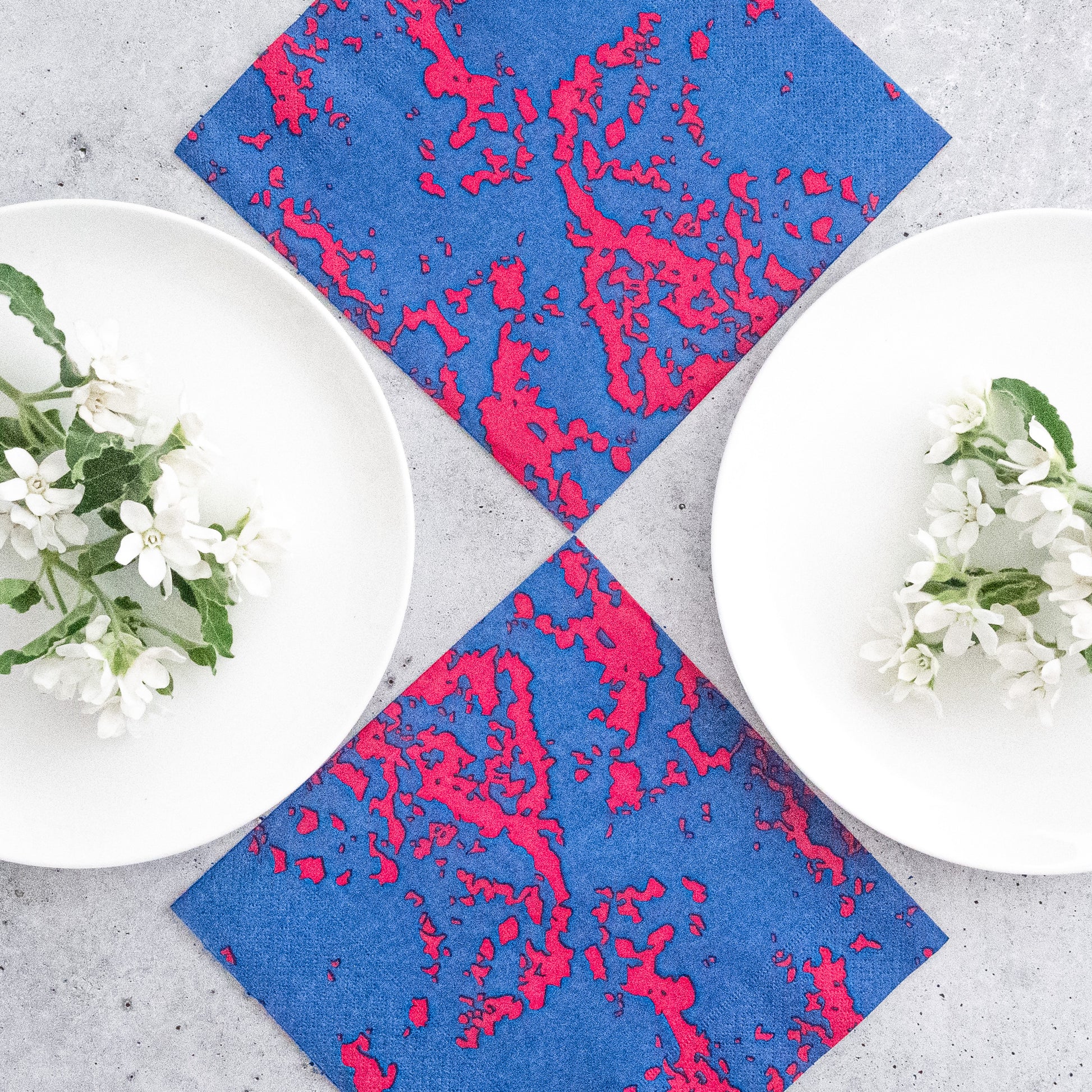 Blue and pink dinner napkin with abstract pattern