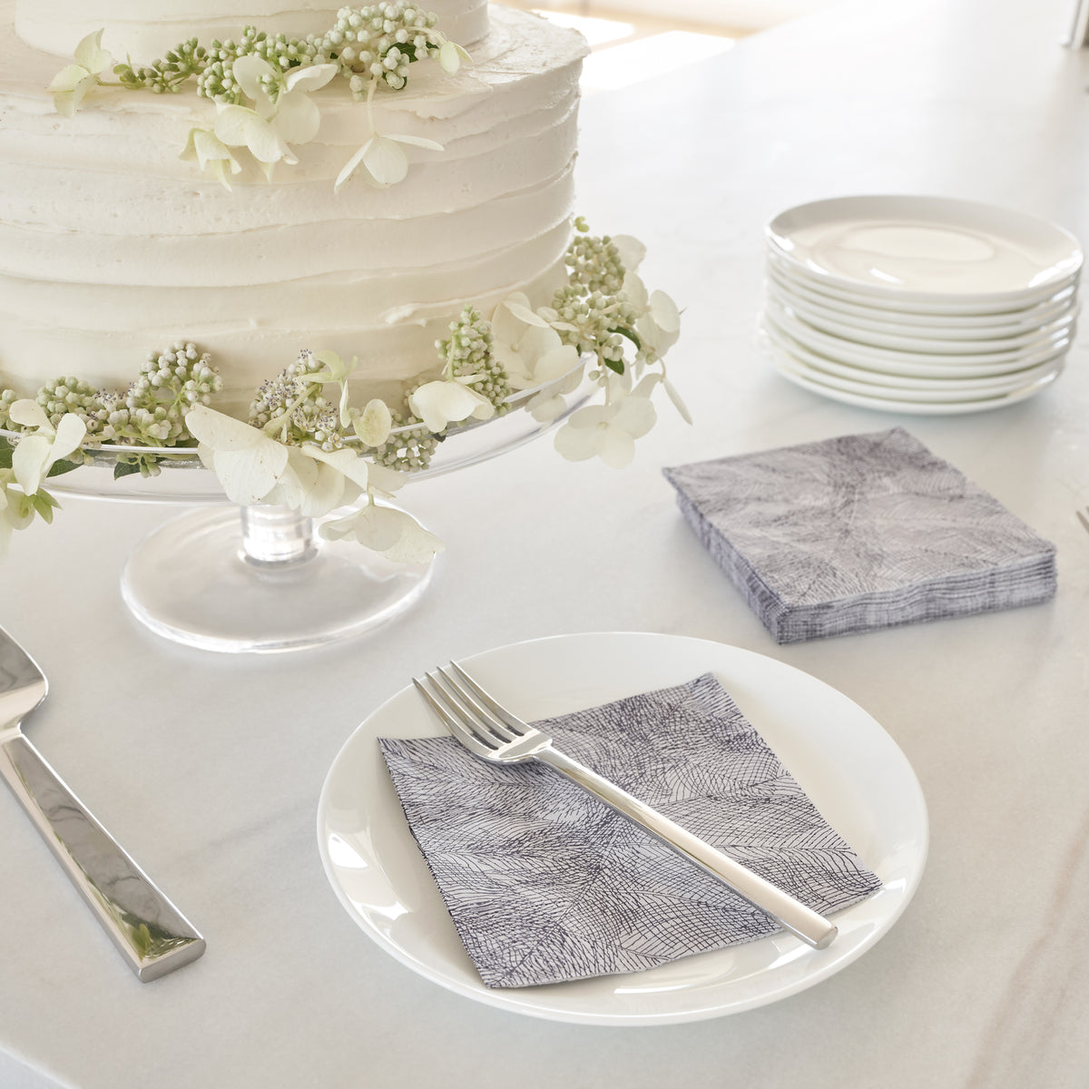 Gray and purple cocktail napkin with abstract pattern