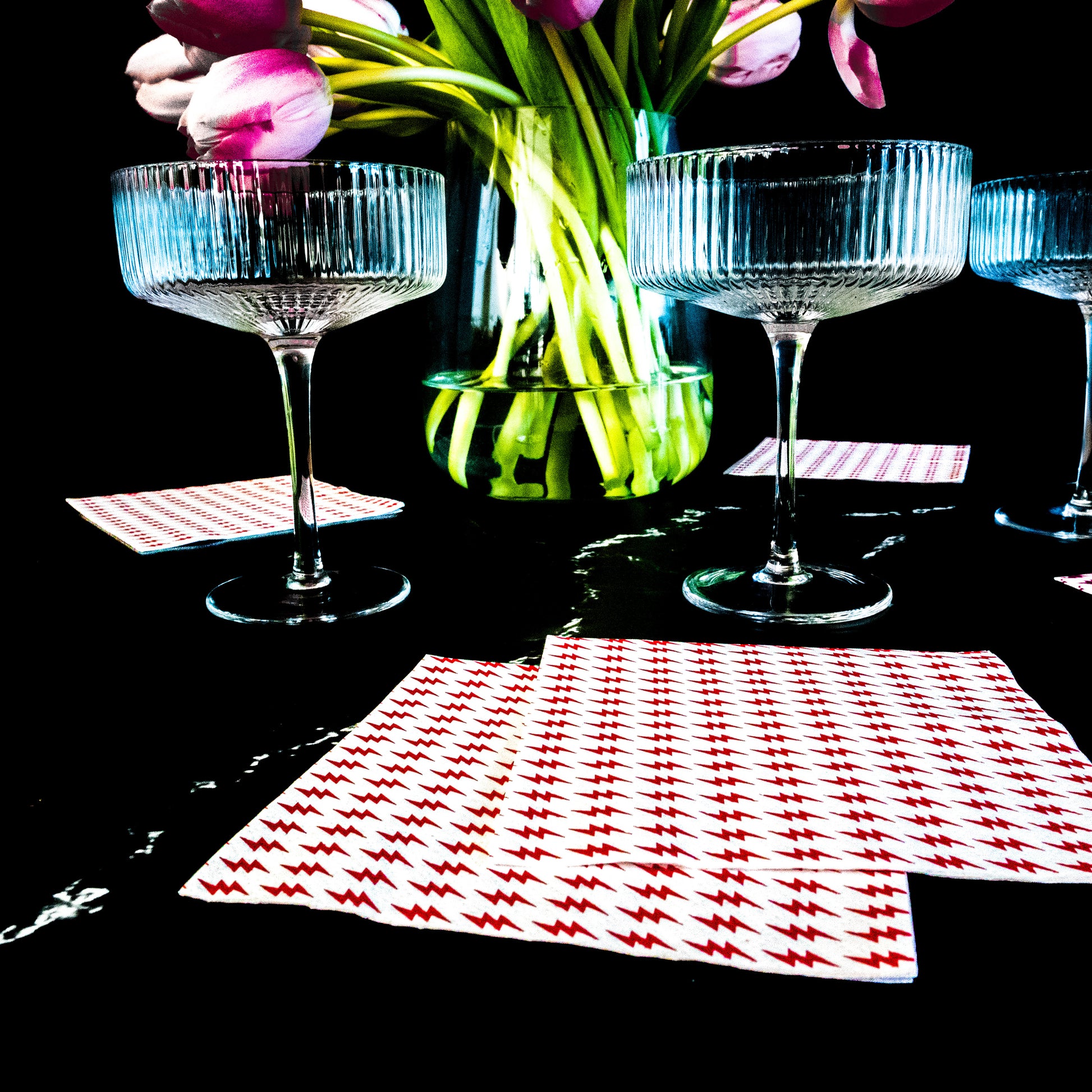 White cocktail napkin with red lightning bolt pattern