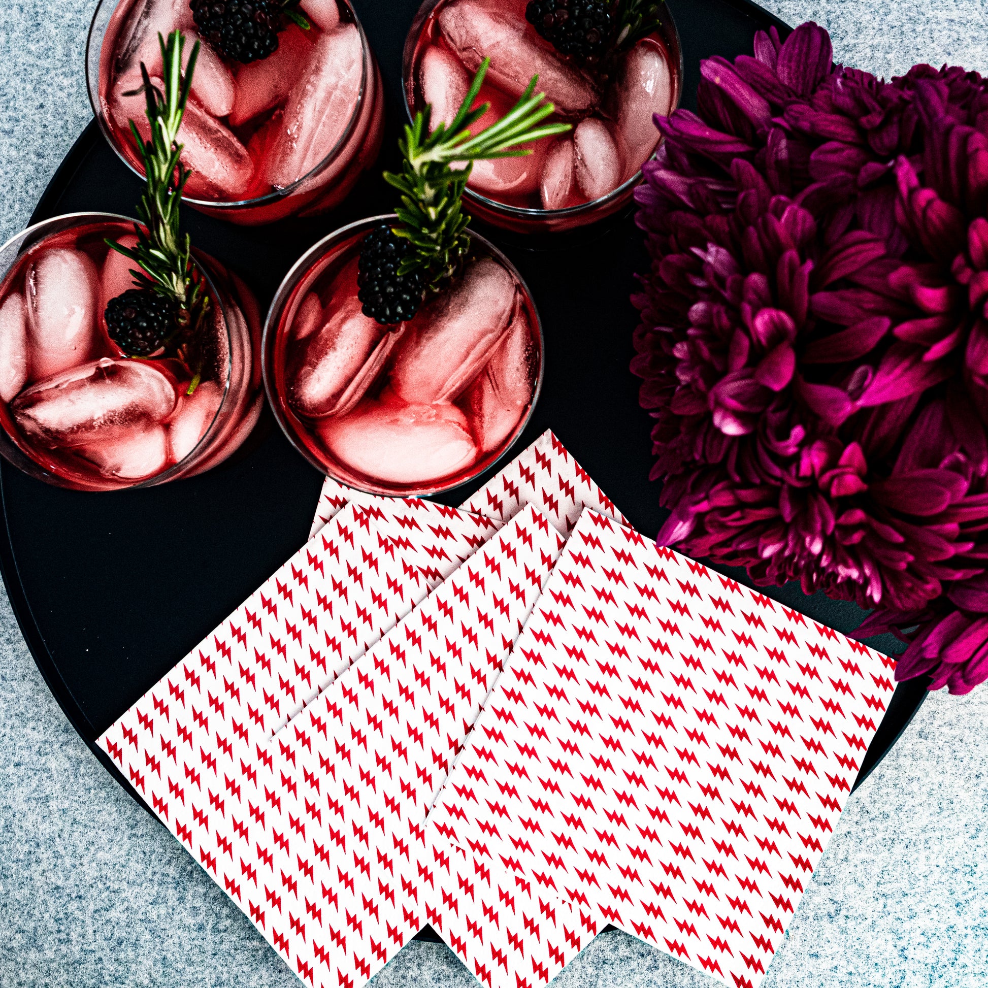 White cocktail napkin with red lightning bolt pattern