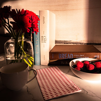 White guest towel napkin with red lightning bolt pattern