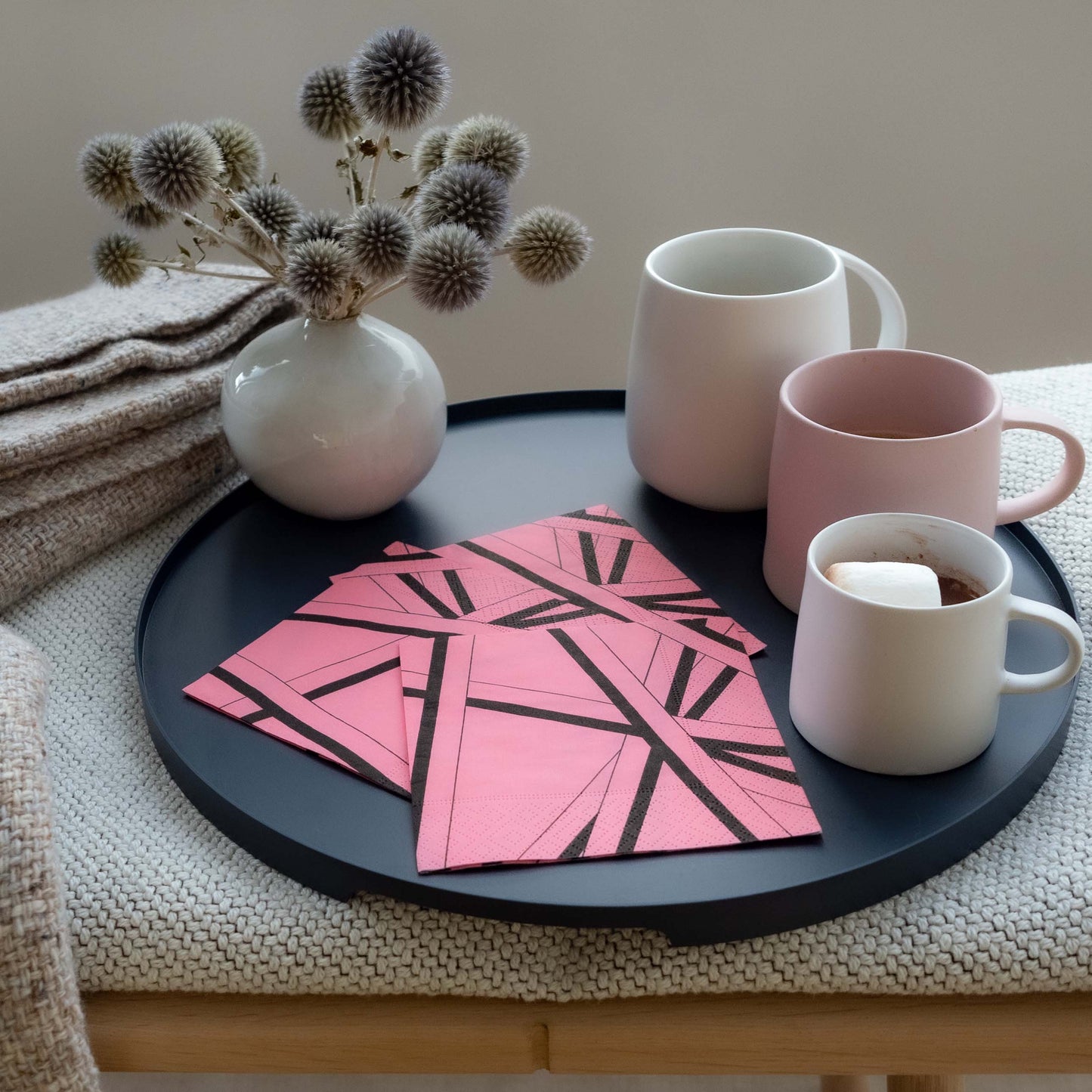 Pink cocktail napkin with black striped pattern