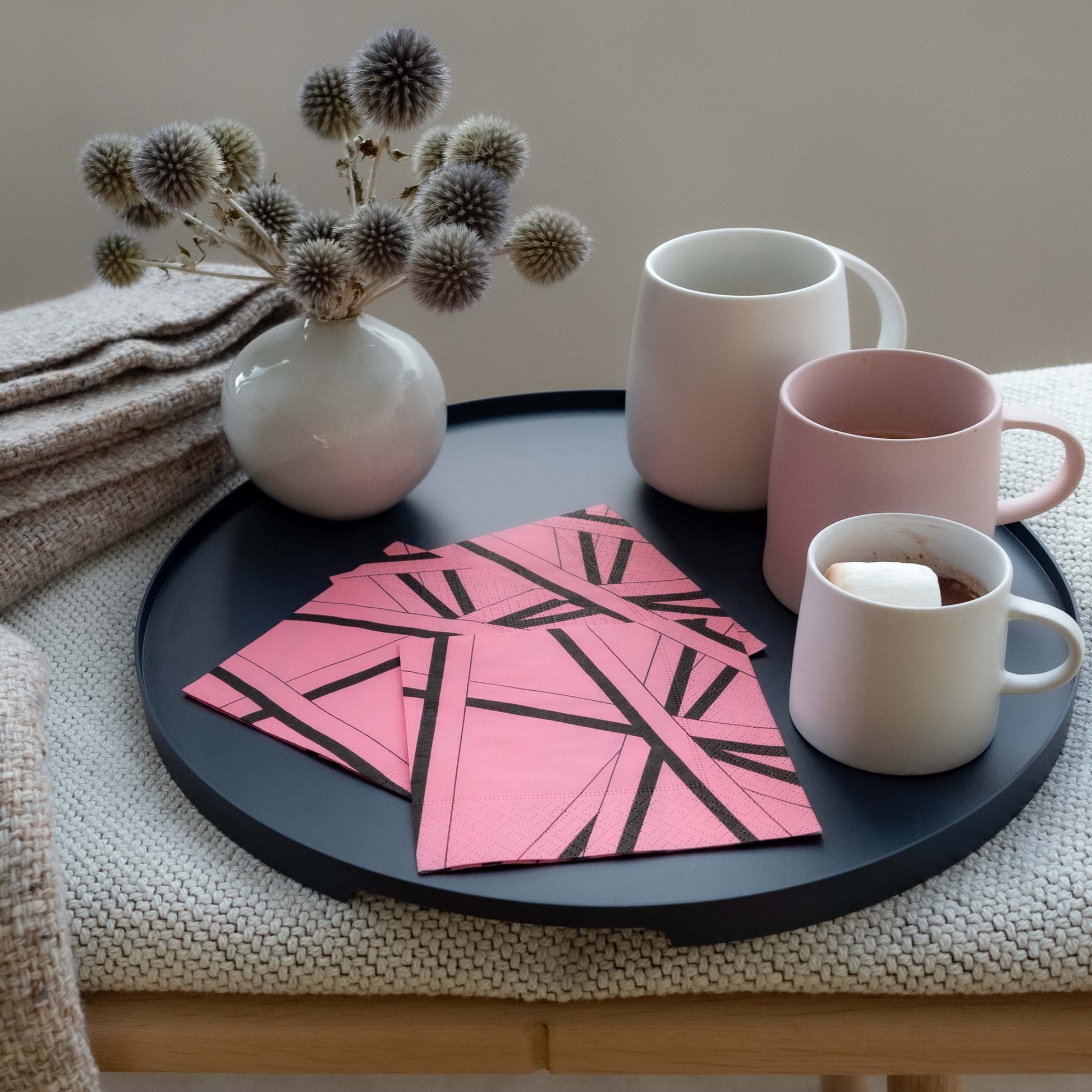 Pink cocktail napkin with black striped pattern