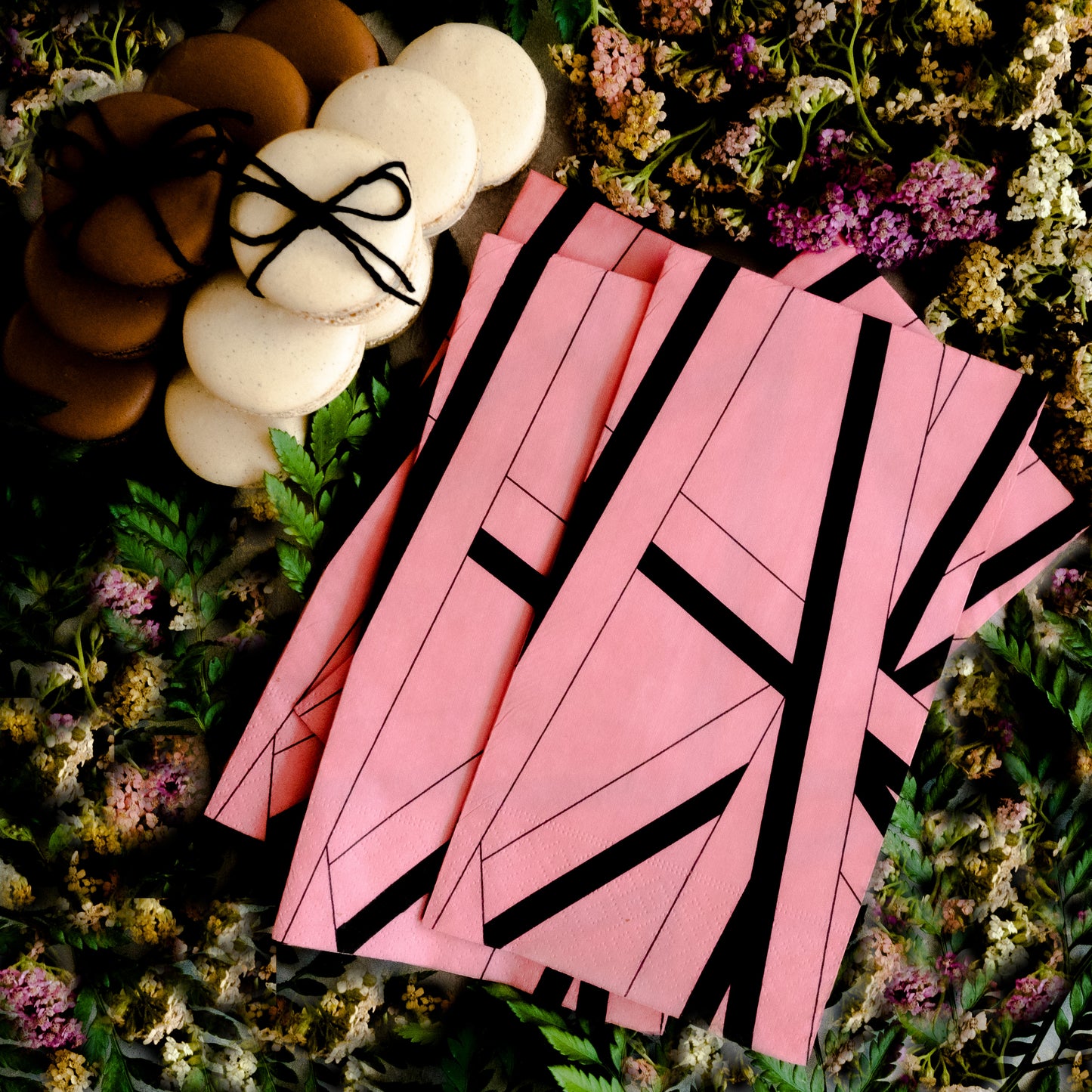 Pink guest towel napkin with black striped pattern